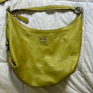Green coach bag with shoulder strap